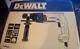 Dewalt D25033 710w Hammer Drill. Wired 230v. 0-1550 Rpm. 0-5680 Bpm. 2.5kg. New